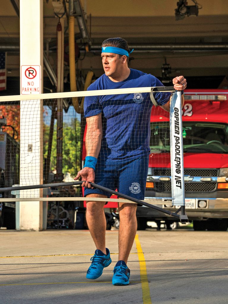 InPickleball |  Morales setting up the temporary pickleball net